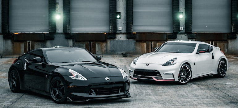 Two cars being prepared for shipping after you learned how to prepare your car for shipping