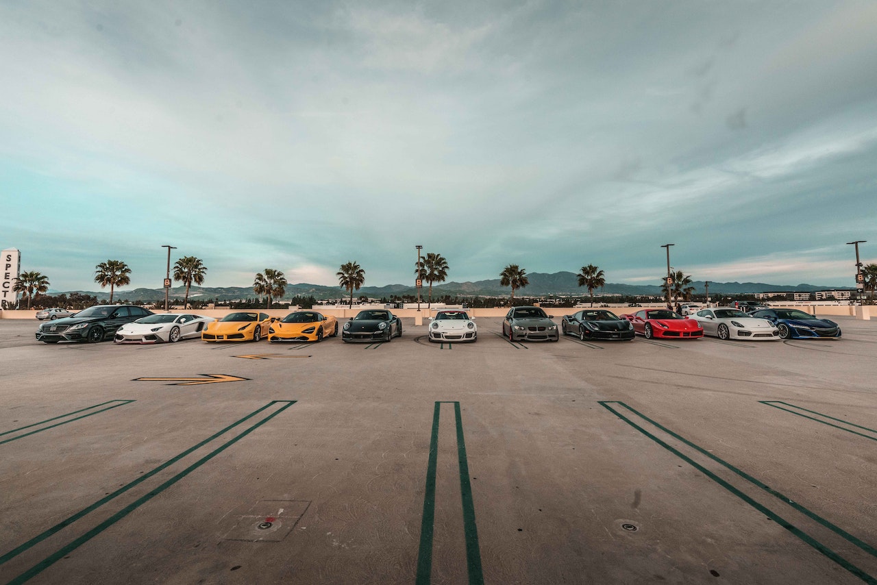 Parked luxury cars on an airport runway