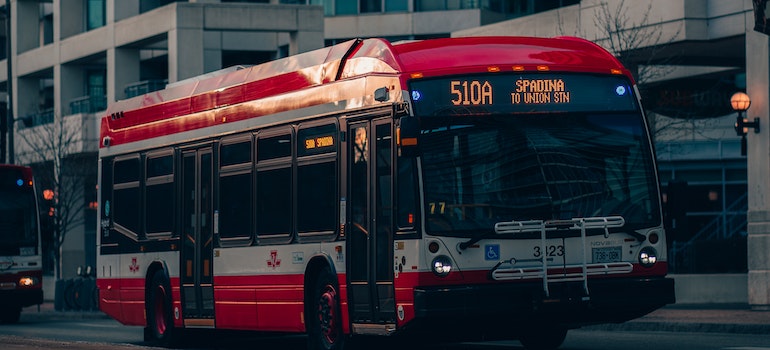 A red public transport bus in Toronto, Ontario