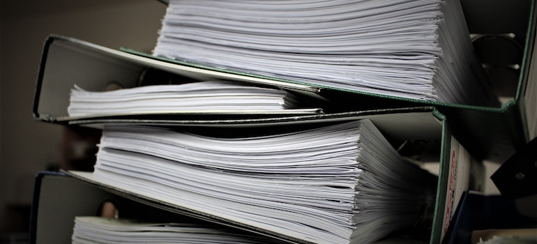 A pile of documents on a table