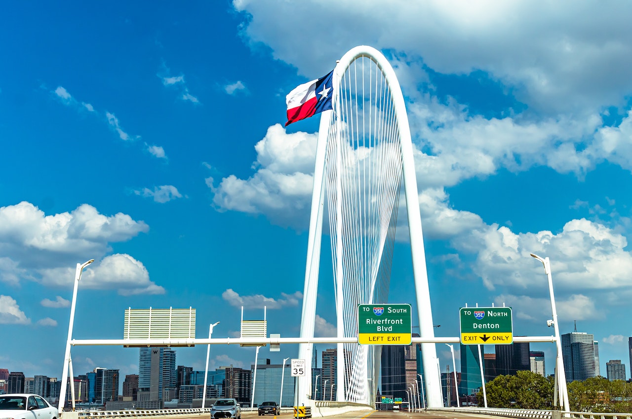 A flag of Texas under the clear sky