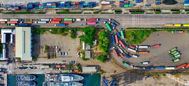 View of a cargo port with lots of colorful trucks parked