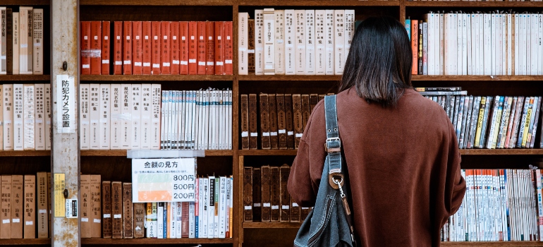A woman in a library after moving to China from US