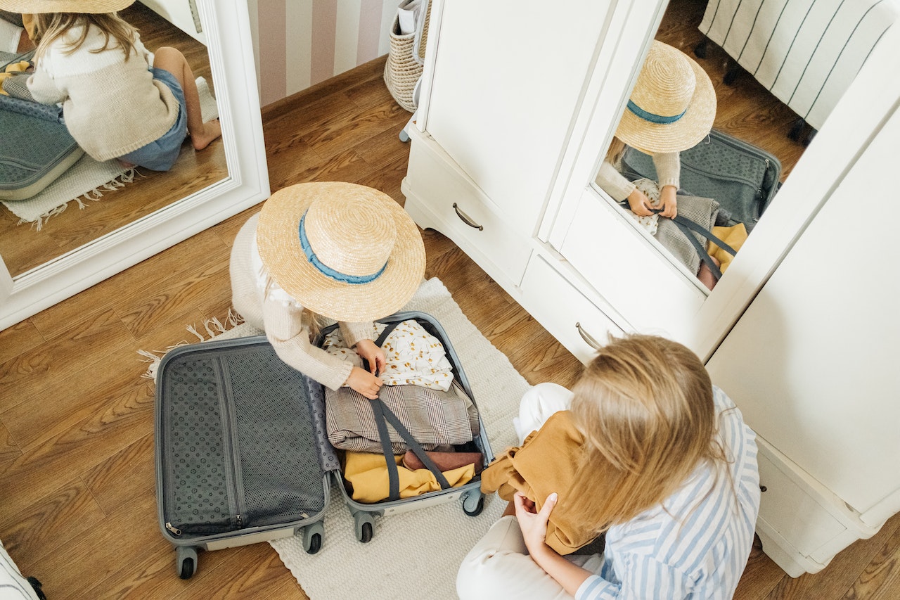 A woman and a child packing for a summer move