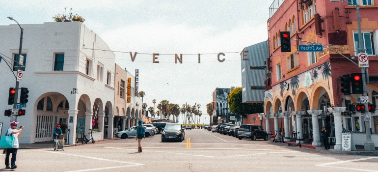 Letters hanging on the string above the street in Venice, a neighborhood you can visit after moving from Albuquerque to Los Angeles