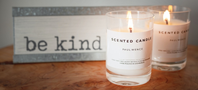 Two scented candles used to create a cozy bedroom