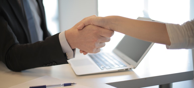 People shaking hands after moving from Virginia to South Carolina