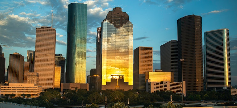 buildings in Texas reflecting the sunset