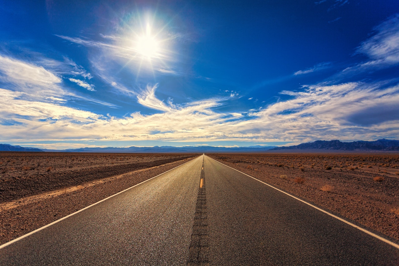 A long road under the sunny sky in one of the Sunbelt states