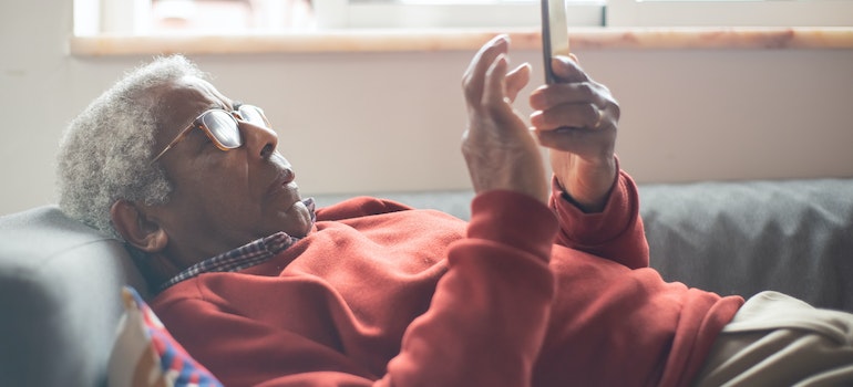 a man looking at his phone searching for the best places to retire in South Carolina