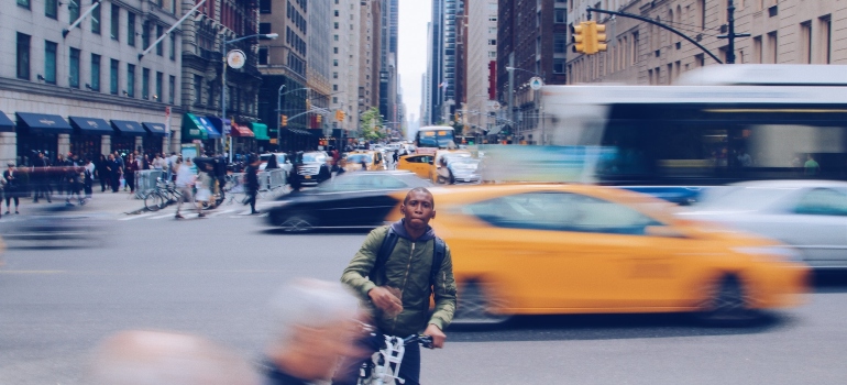 Picture of a person driving a bycicle after moving to New York City