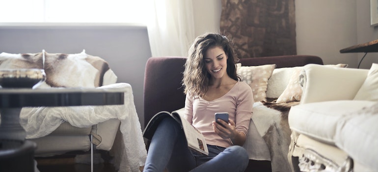 a happy girl looking at her phone