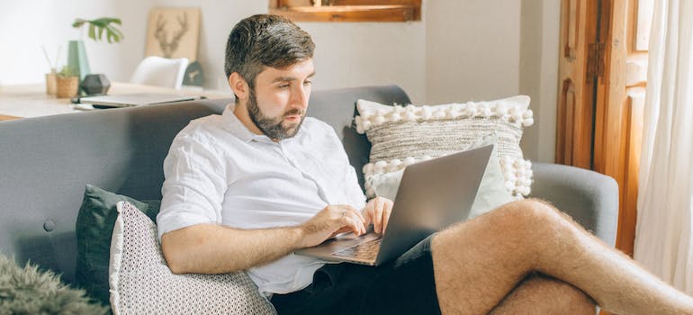 a man reading an article on Moving Your Home Office