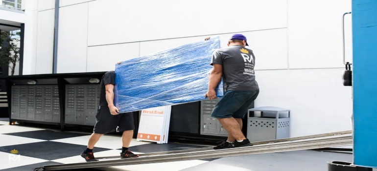 Movers handling a piece of furniture