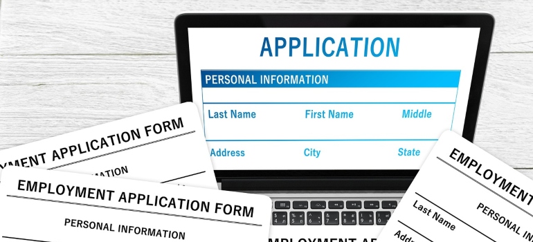 application forms and laptop