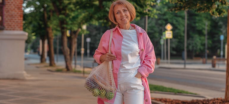woman holding a bag with groceries