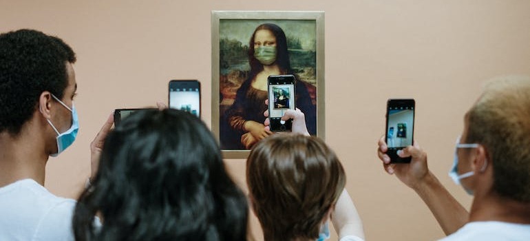 People taking pictures in a museum