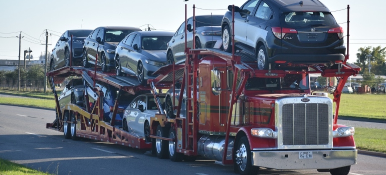red truck car carrier as option when shipping a car from New Jersey to Florida