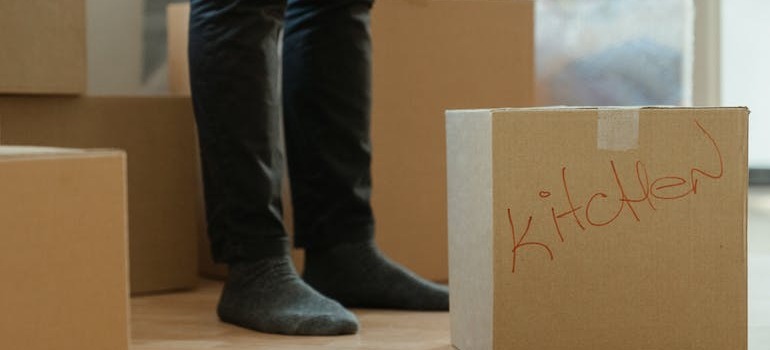 A person in front of a moving box