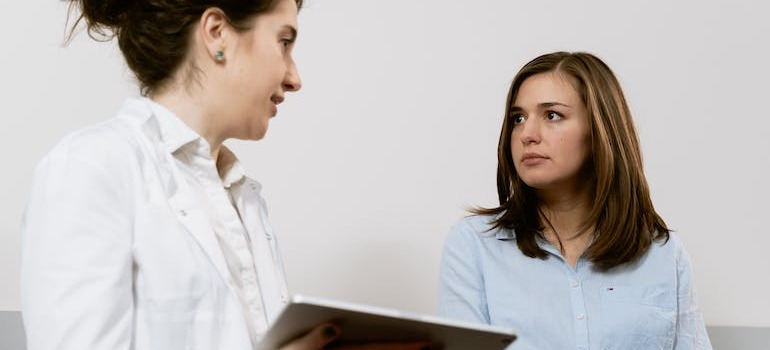 A doctor talking with her patient