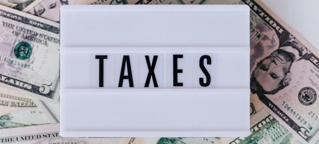 Taxes written on a white surface