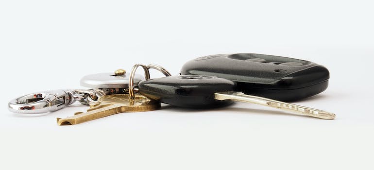 car keys on a white surface