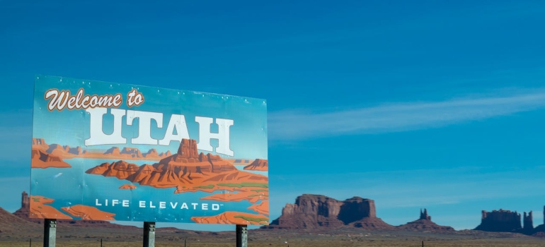 welcoming Utah billboard under the clear sky beckons retirees to explore the various places to retire in Utah.