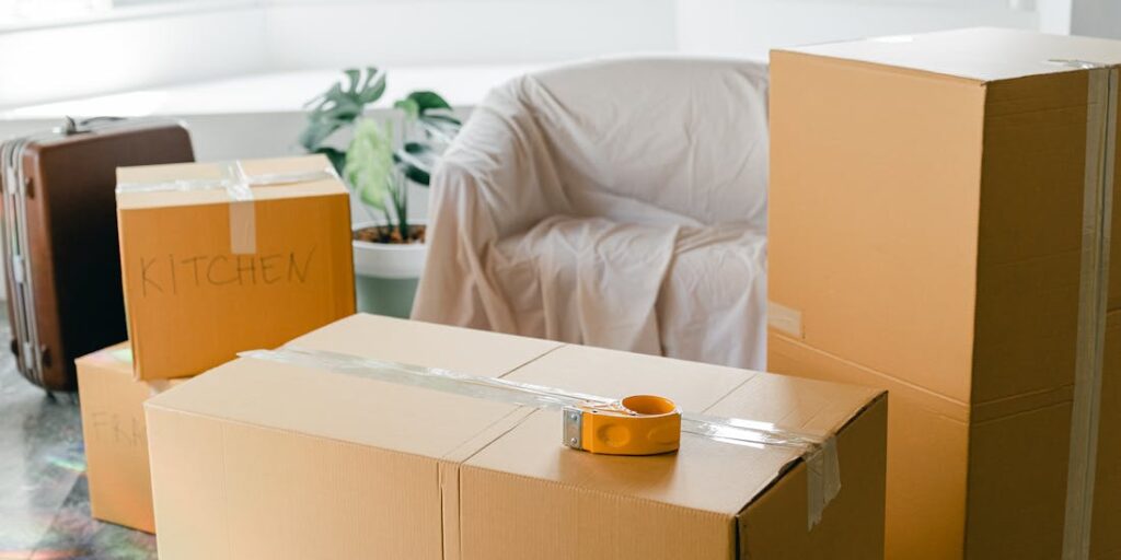 Sealed and labeled moving boxes in a living room
