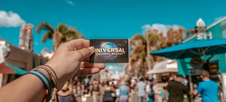 person holding Universal Studio card
