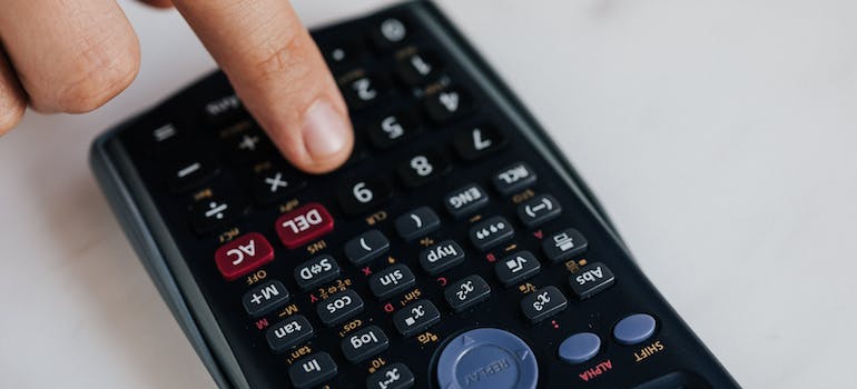 person using black calculator
