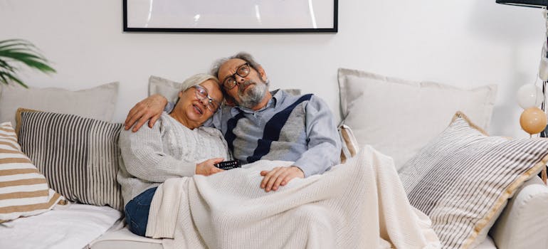 elderly couple watching tv