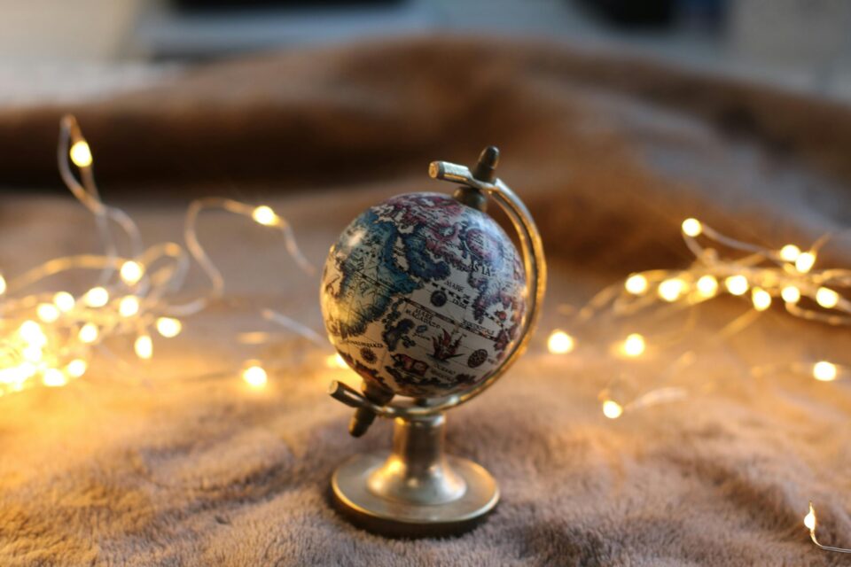 Little globe on a soft surface, lights behind it