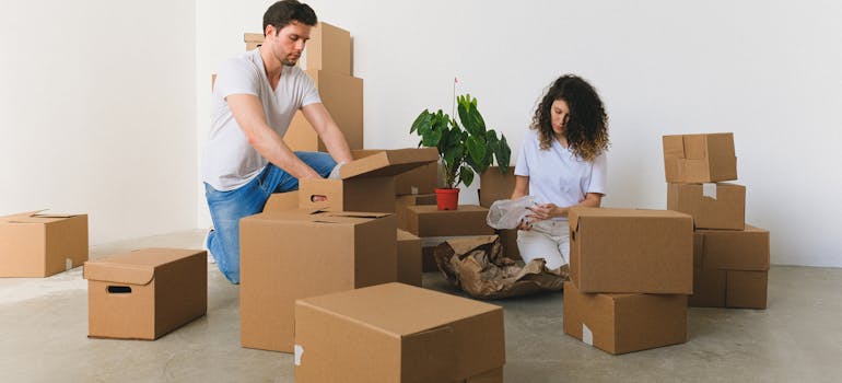 man and woman packing before finding a job in new city