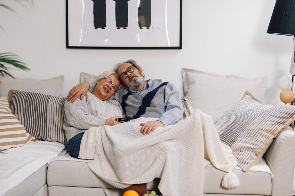 senior couple sitting on a sofa
