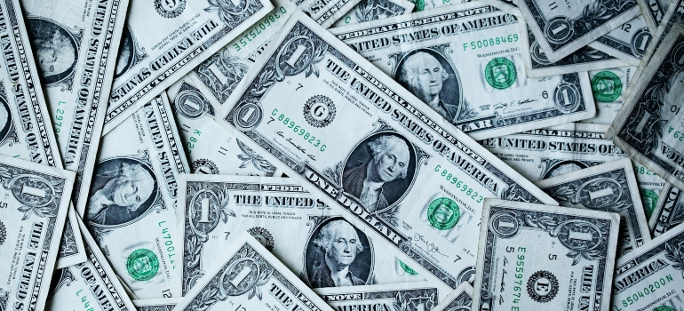 Picture of dollar bills that can be saved after moving to Ohio