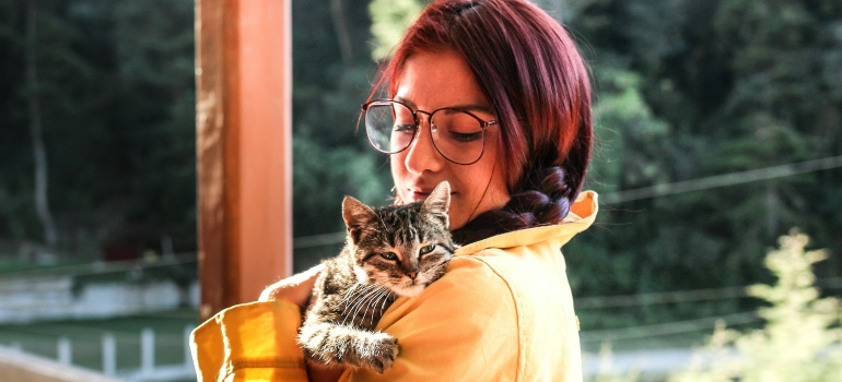 Picture of a person looking at their cat