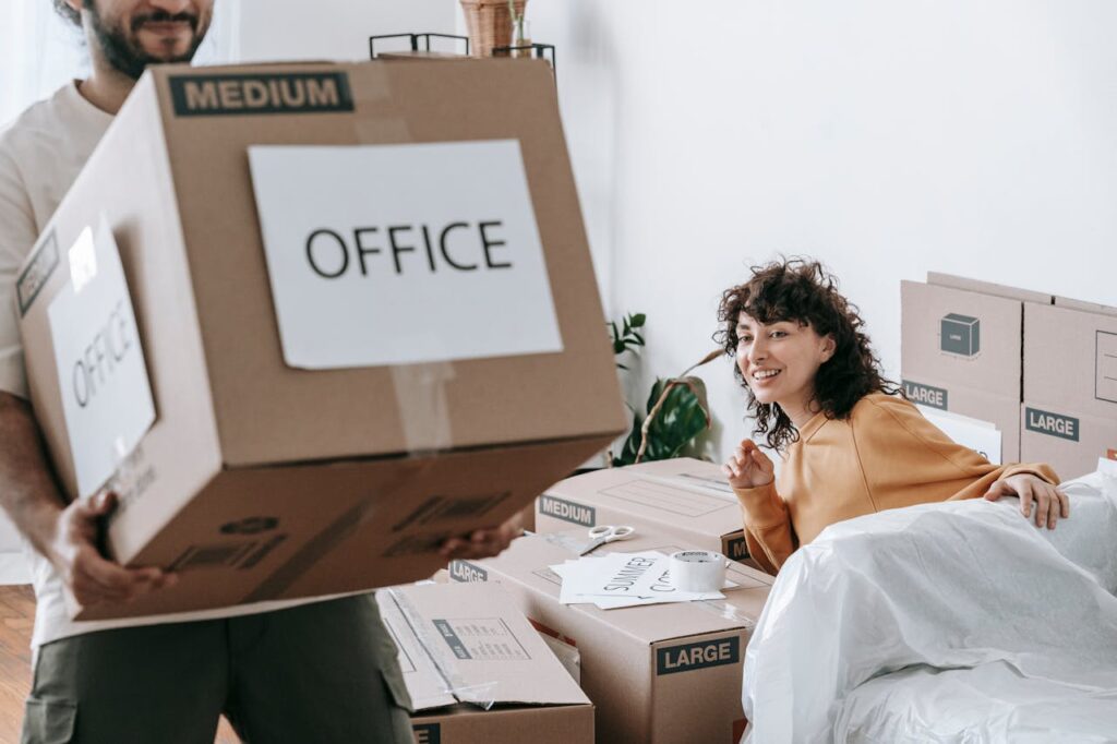 a couple moving their home and office