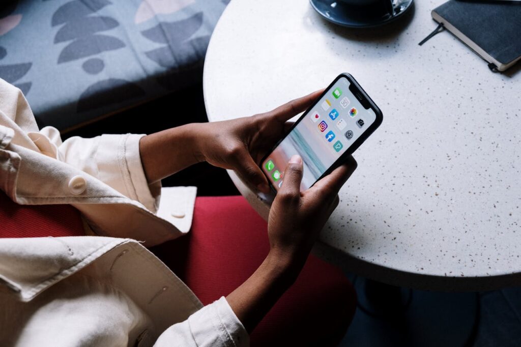 woman using her smartphone and trying to find free packing materials
