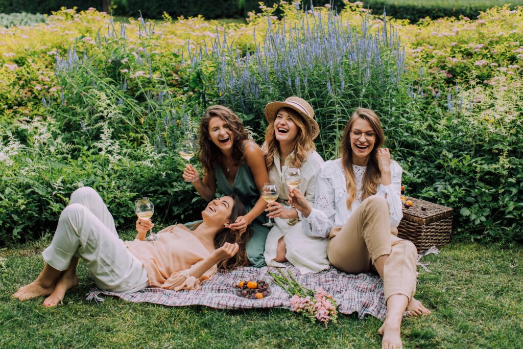 Four women having a picnic and laughing