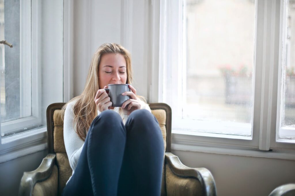 woman sitting and enjoying a drink