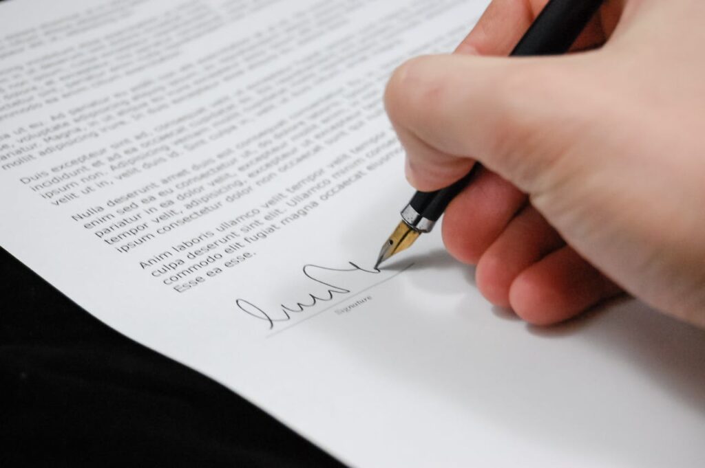 person signing a contract