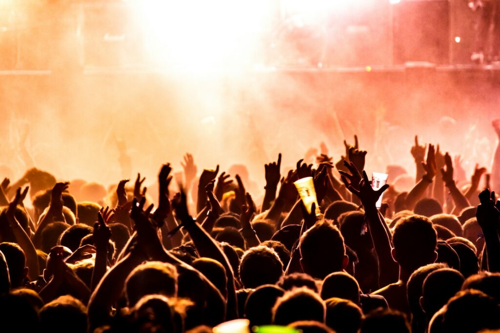 People with their hands up at a concert in one of the best cities for job seekers in Nevada