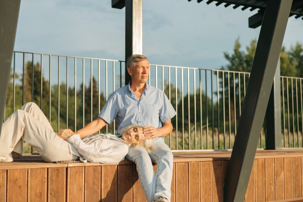 an elderly couple sitting