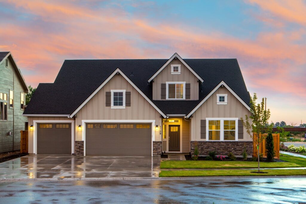 a brown house with lights on