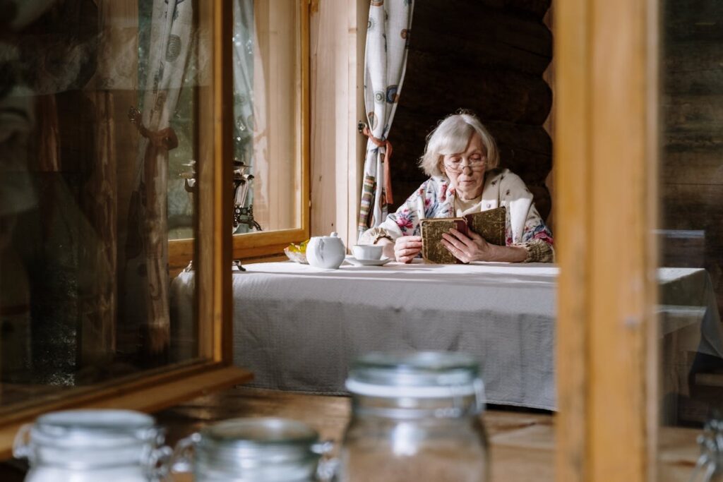 elderly woman reading a book