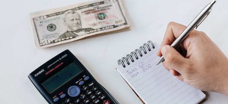 person calculating costs