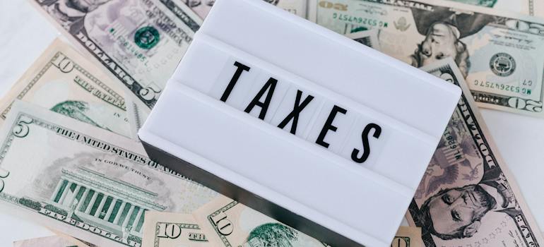 taxes sign on money