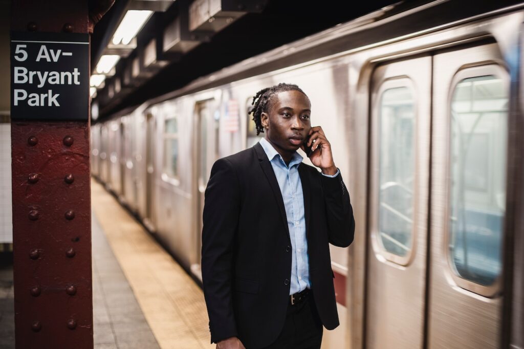 man standing at metro station