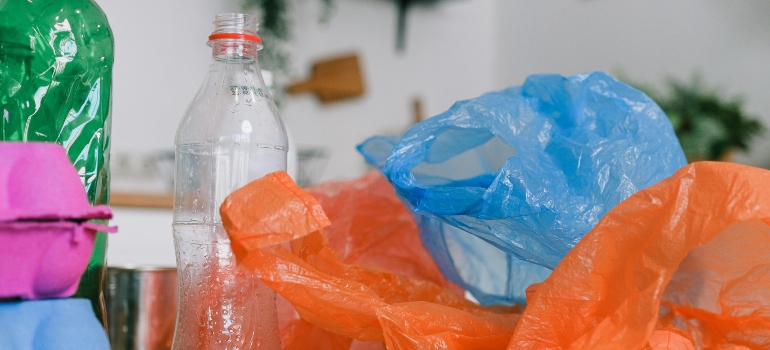 Plastic bottles and bags prepared for recycling.