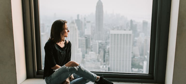 woman looking through the window